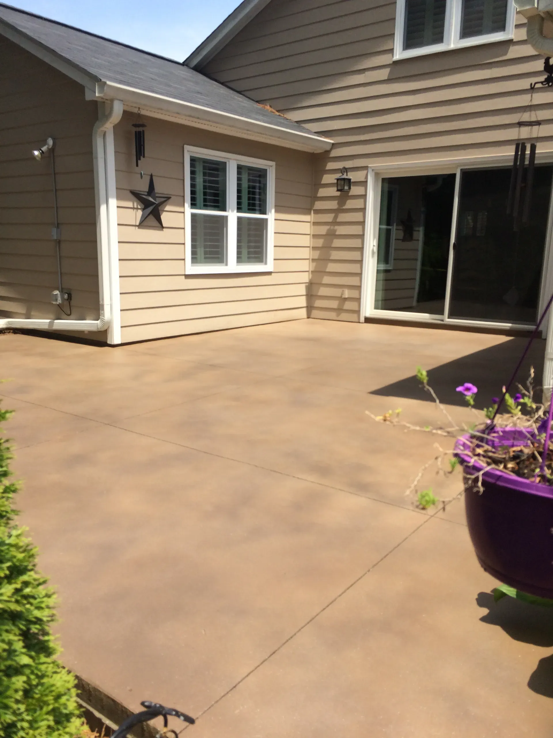 Warm tan stained concrete patio resurfaced by JP Concrete Creations in North Georgia