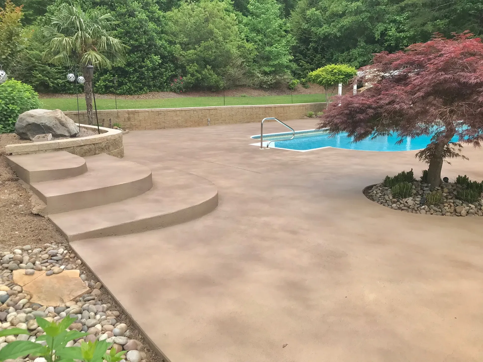Slip-conscious textured pool deck finish by JP Concrete Creations, Georgia concrete artists