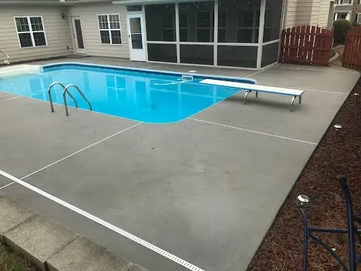 Concrete surface restored with resurfacing and decorative finish by JP Concrete Creations