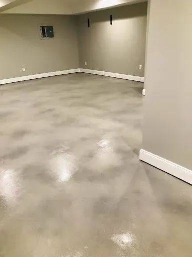 Worn concrete transformed with resurfacing and decorative stain in the Kennesaw area
