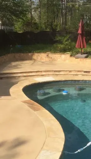 James Peters of JP Concrete Creations hand-finishing a decorative concrete surface