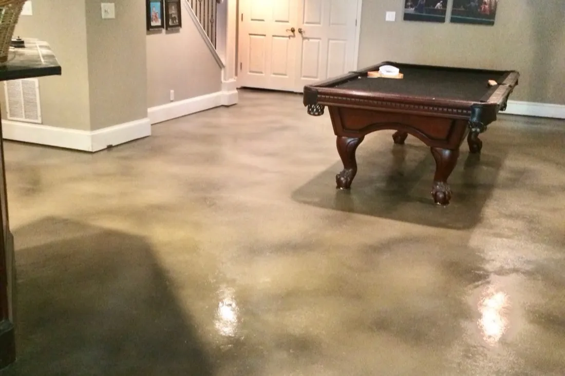 Finished basement floor with warm stained concrete by JP Concrete Creations in metro Atlanta